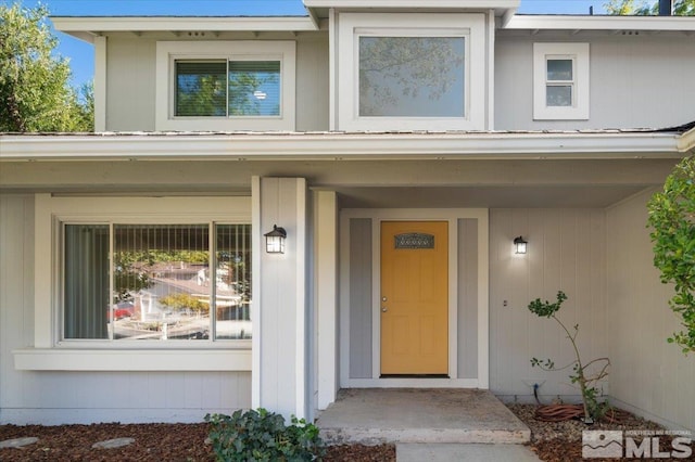 property entrance with covered porch