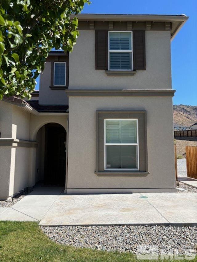 rear view of property featuring a patio area