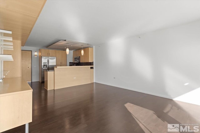 unfurnished living room featuring dark hardwood / wood-style floors