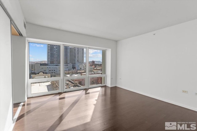 spare room featuring hardwood / wood-style floors