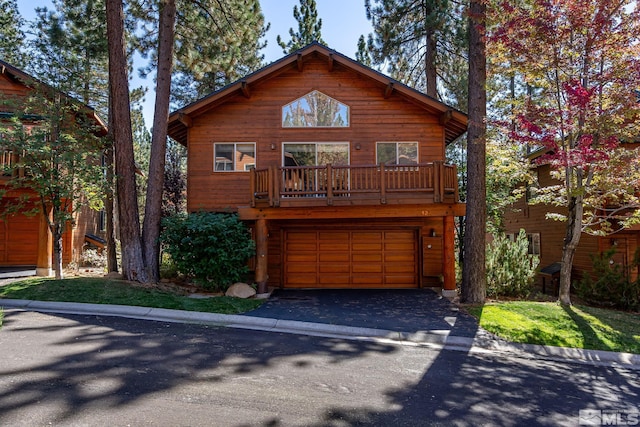 view of front of property with a balcony and a garage