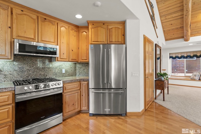 kitchen featuring appliances with stainless steel finishes, wood ceiling, lofted ceiling with beams, tasteful backsplash, and light hardwood / wood-style flooring