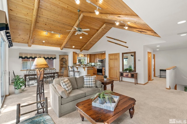 living room with wood ceiling, beam ceiling, and light carpet