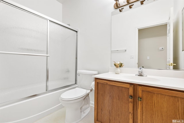 full bathroom featuring combined bath / shower with glass door, vanity, and toilet