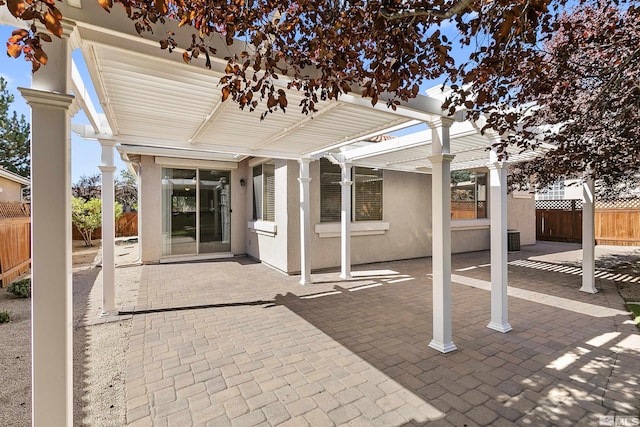 view of patio featuring central AC unit and a pergola