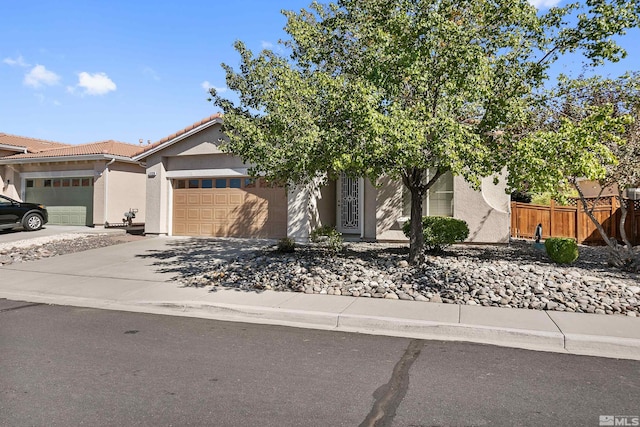 obstructed view of property with a garage