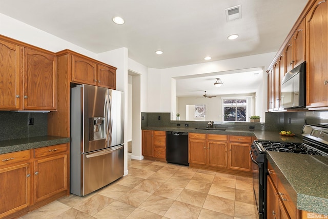 kitchen with backsplash, ceiling fan, sink, and black appliances