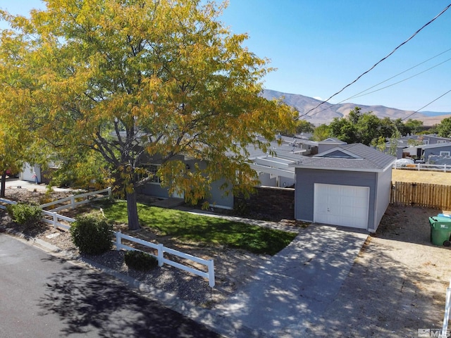 view of front of house with a garage and a mountain view