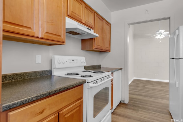 kitchen featuring light hardwood / wood-style floors, ceiling fan, and white appliances