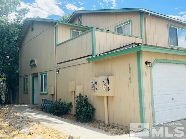 view of side of home with a garage