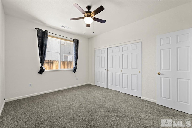 unfurnished bedroom featuring carpet floors, a closet, and ceiling fan