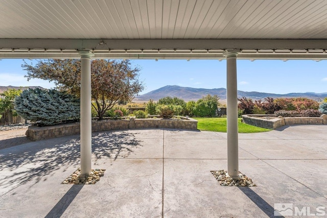 view of patio / terrace featuring a mountain view