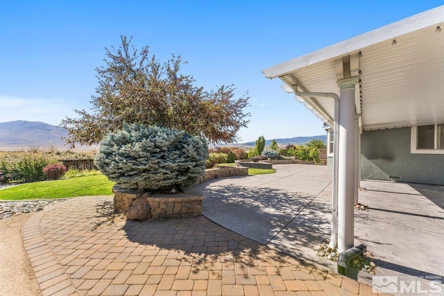 view of patio with a mountain view