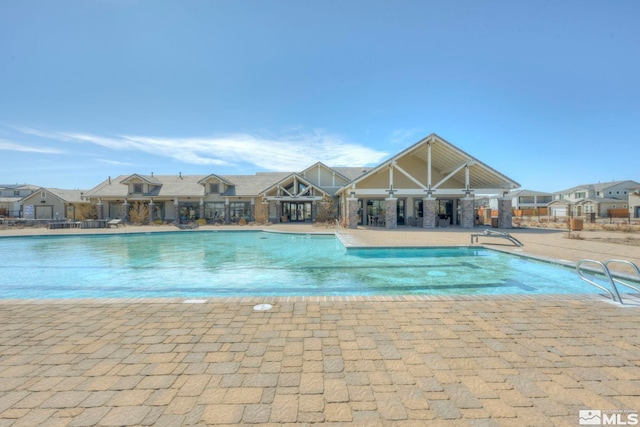 view of swimming pool with a patio