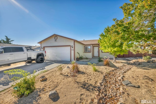 ranch-style house featuring a garage