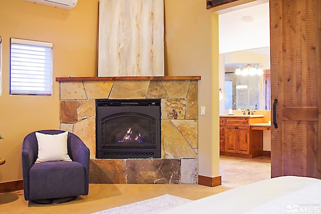 interior details featuring sink and a wall unit AC