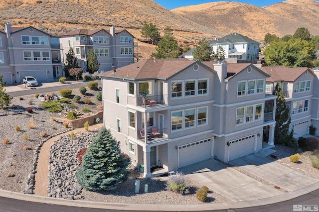 birds eye view of property featuring a mountain view