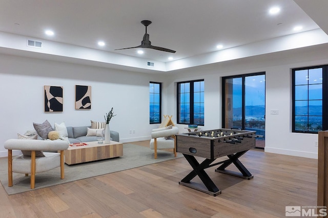 recreation room featuring light wood-type flooring and ceiling fan