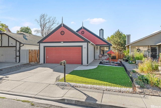 view of front of home with a garage and a front yard