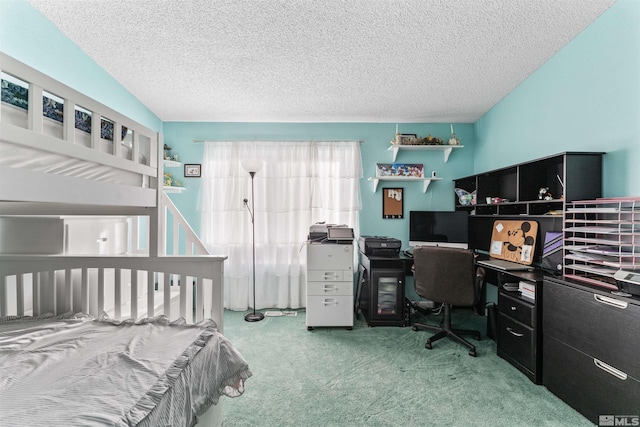 carpeted bedroom with a textured ceiling