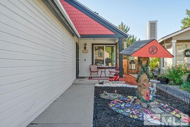 doorway to property with a porch