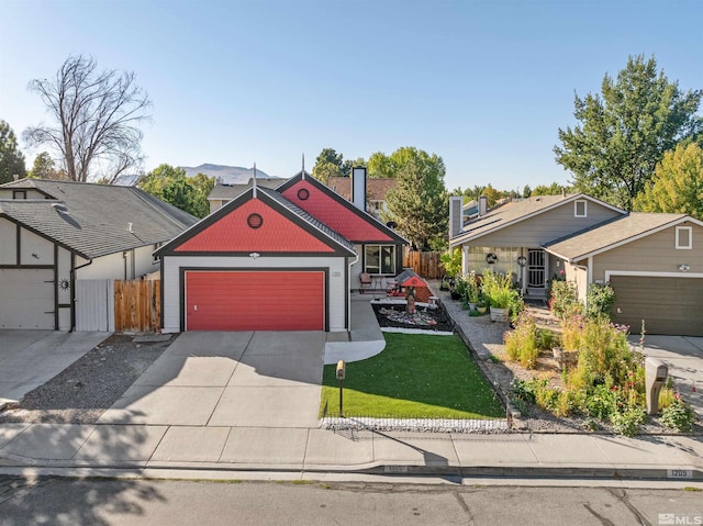 view of front facade featuring a front yard and a garage