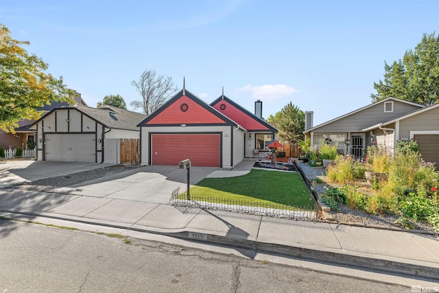 view of front of house featuring a front yard and a garage