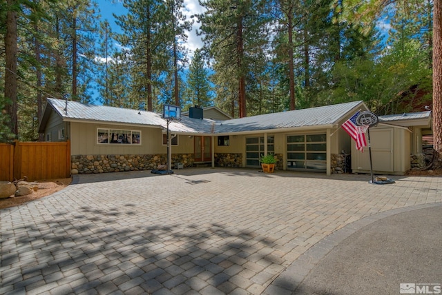 view of front facade with a storage shed