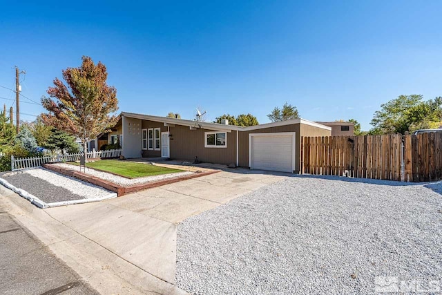 ranch-style home featuring a garage