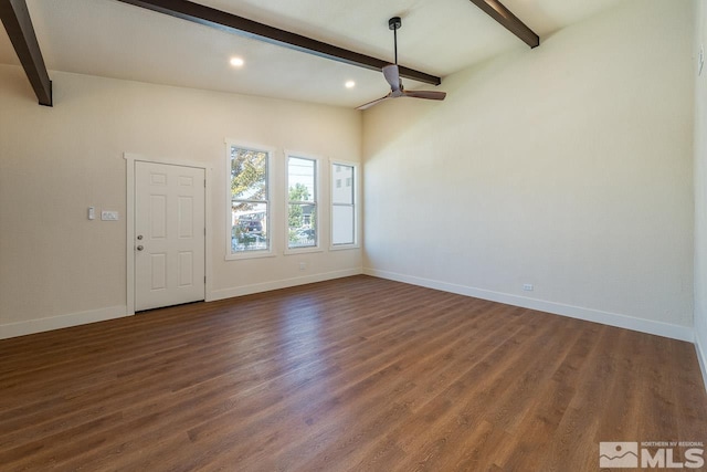 interior space featuring lofted ceiling with beams, dark hardwood / wood-style flooring, and ceiling fan