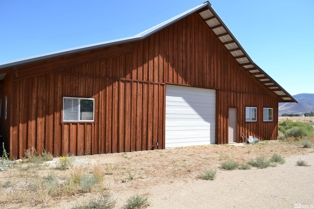 exterior space with an outdoor structure and a garage