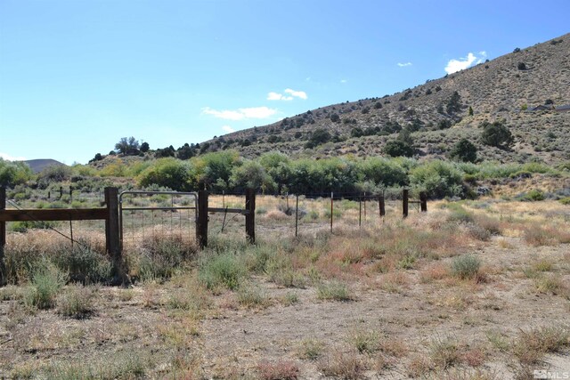 property view of mountains featuring a rural view