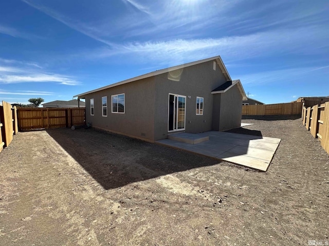 rear view of house with a patio