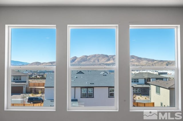 interior space featuring a wealth of natural light and a mountain view