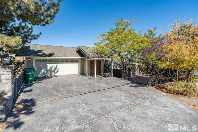 ranch-style house featuring a garage