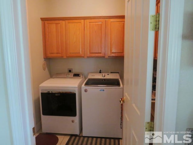 laundry room featuring cabinets and independent washer and dryer