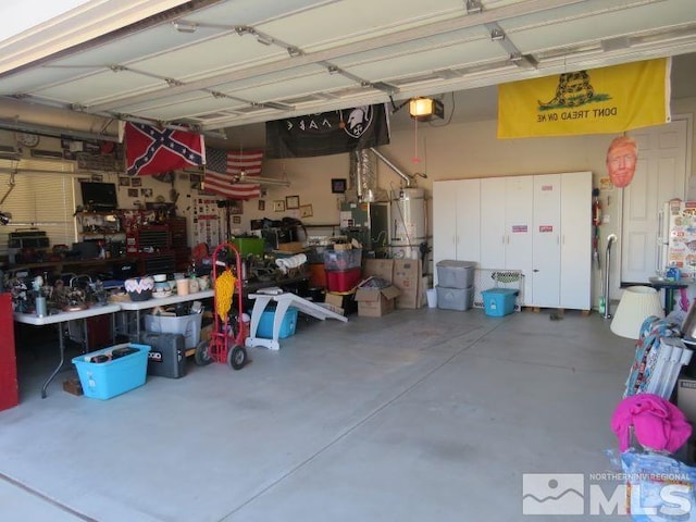 garage with a garage door opener and a workshop area