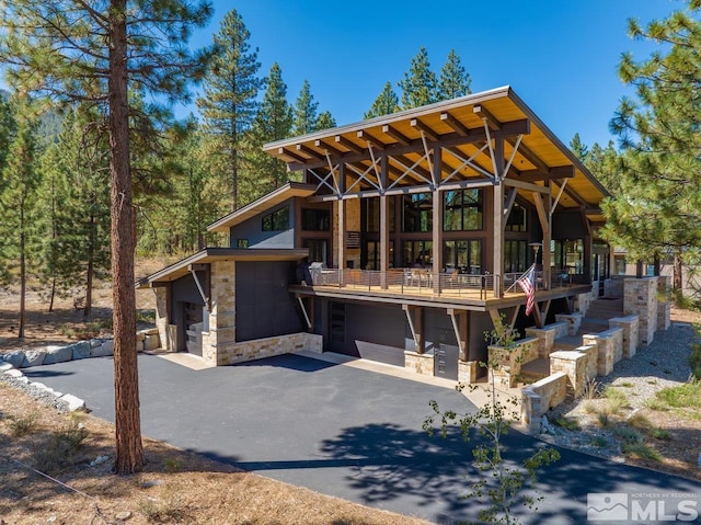 back of house featuring a garage