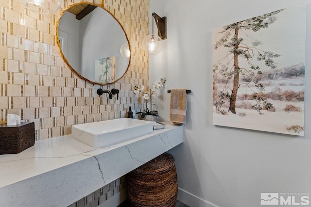 bathroom with tile walls and vanity