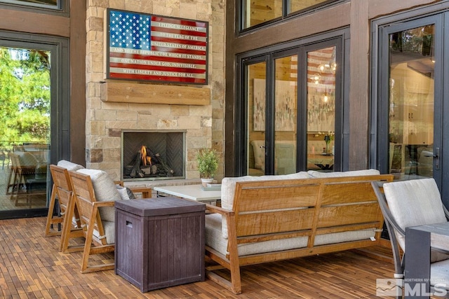 interior space with hardwood / wood-style flooring and a fireplace