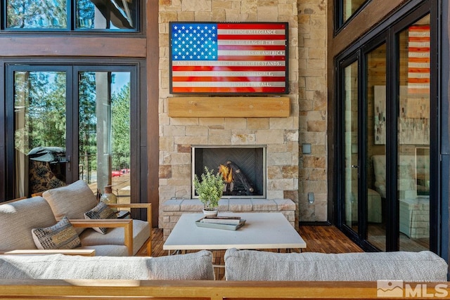 living room featuring a fireplace and dark wood-type flooring