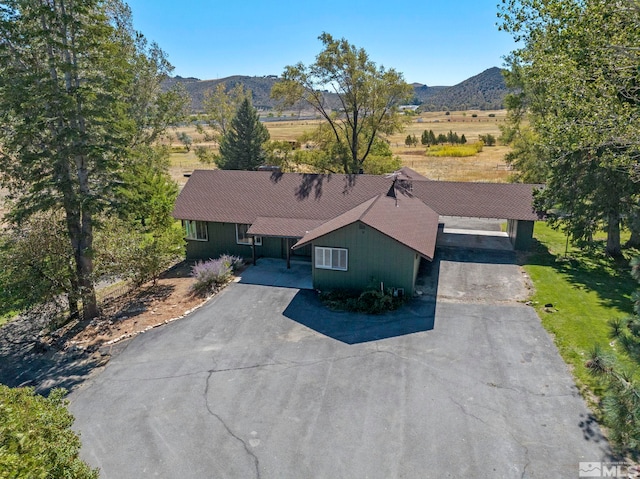 birds eye view of property featuring a mountain view