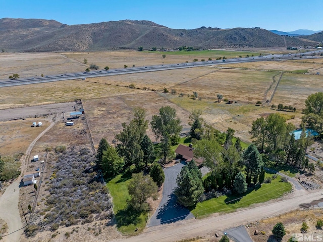 drone / aerial view featuring a mountain view and a rural view