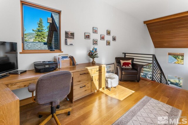 office featuring light wood-type flooring and vaulted ceiling