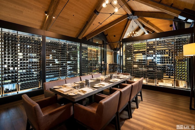 wine area featuring wooden ceiling, vaulted ceiling with beams, wood-type flooring, and a notable chandelier