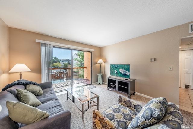 living room featuring light tile patterned flooring