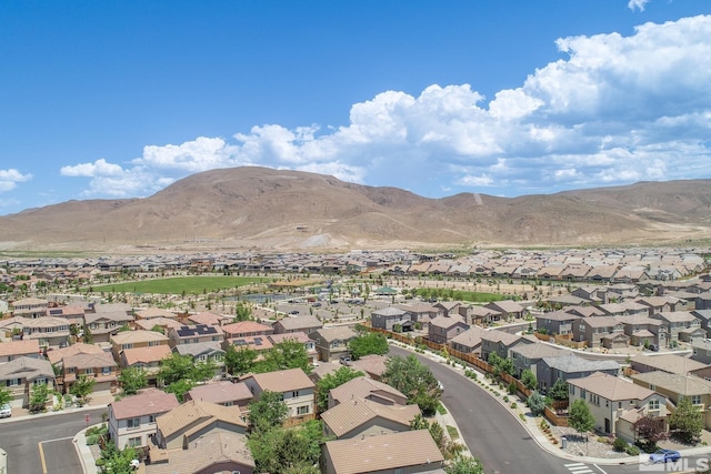 birds eye view of property with a mountain view