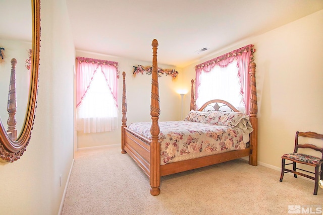 bedroom with light colored carpet