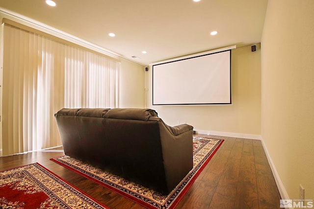 cinema room with dark hardwood / wood-style floors