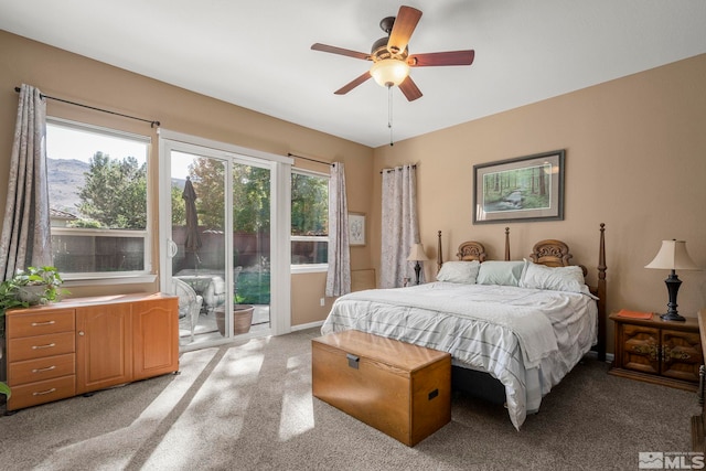 carpeted bedroom with a ceiling fan, baseboards, and access to exterior